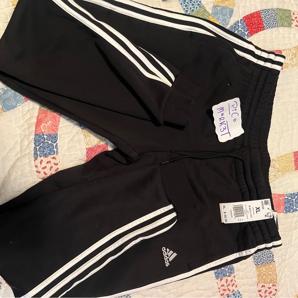 Adidas Black and White Track Pants with Iconic Stripes